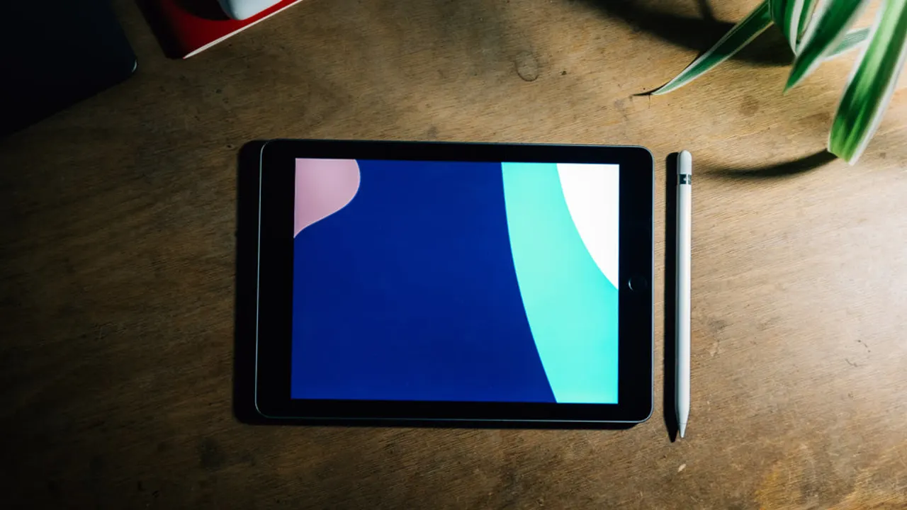Tablet on wooden desk.