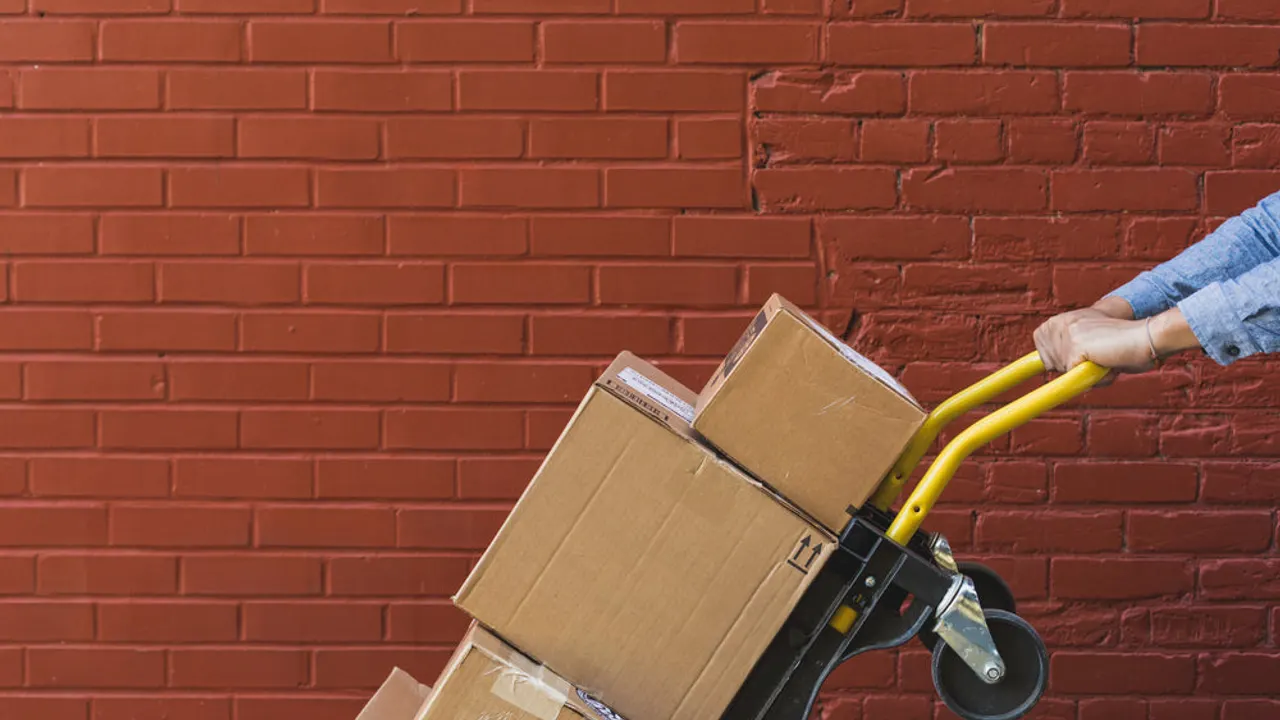 Shipping boxes on red brick.