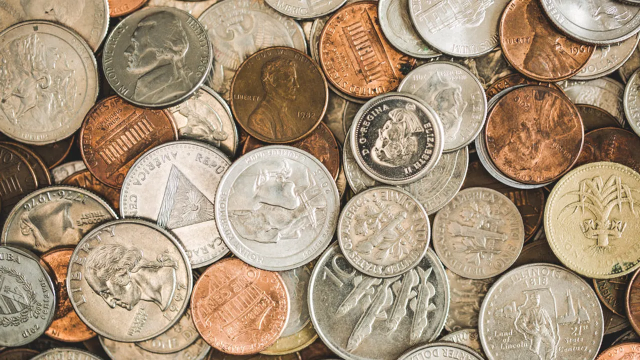 Coins spread out pile.
