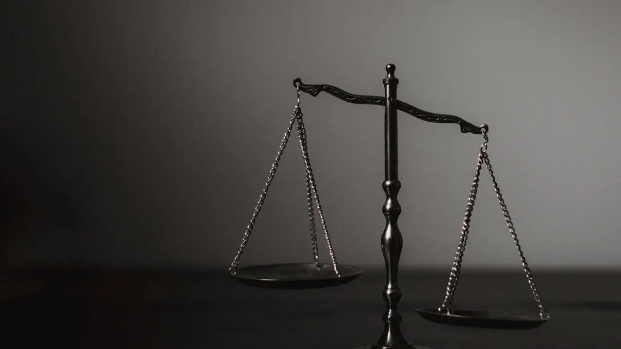 Balance scale tilted right.