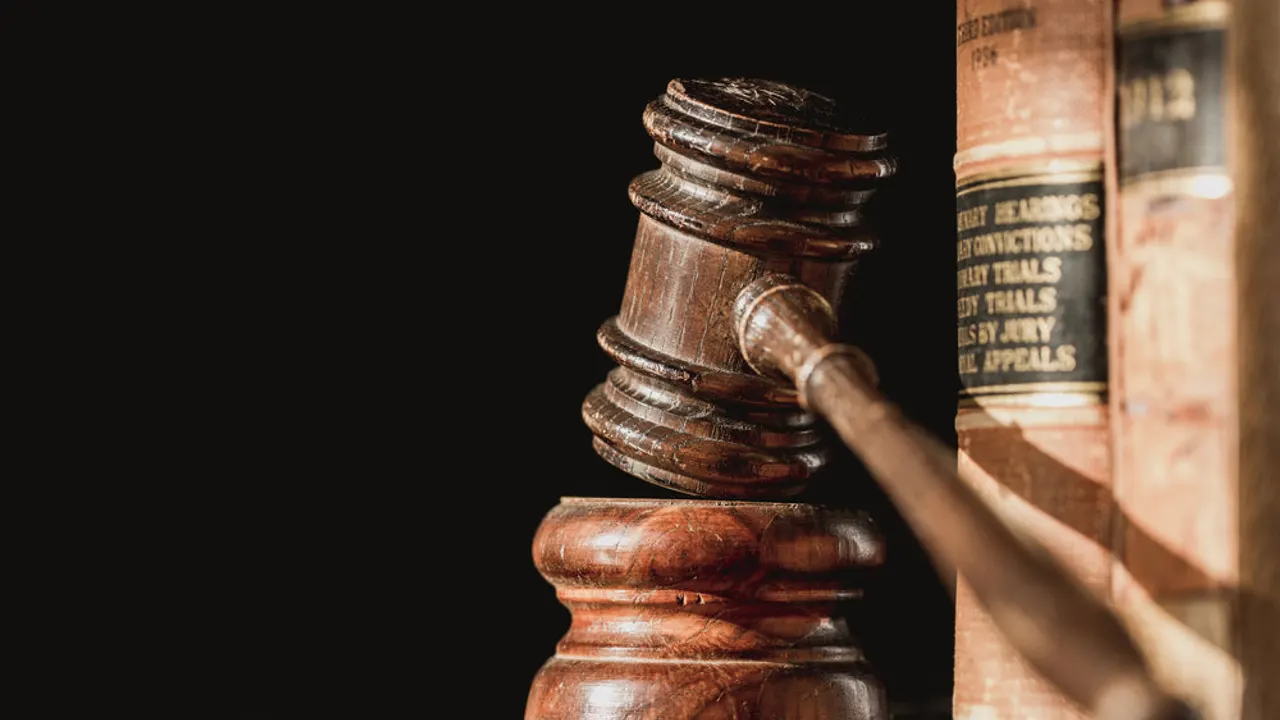 Law books and judge gavel.