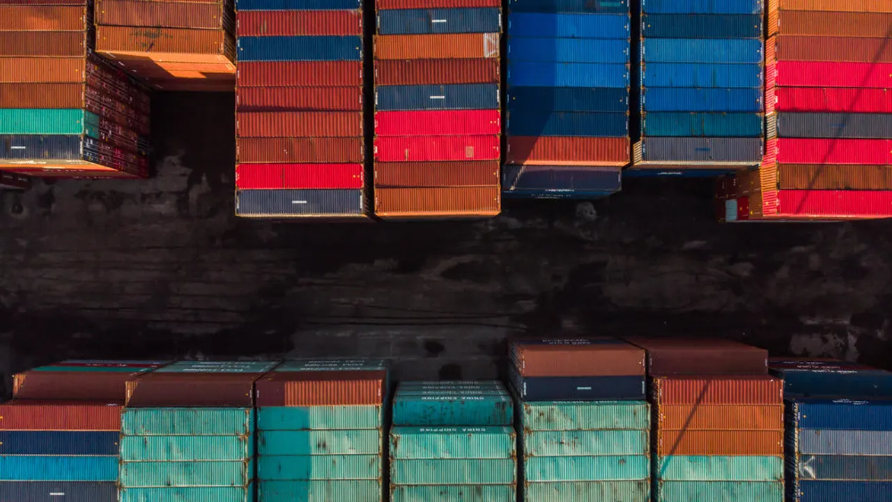 Two rows of stacked shipping containers.